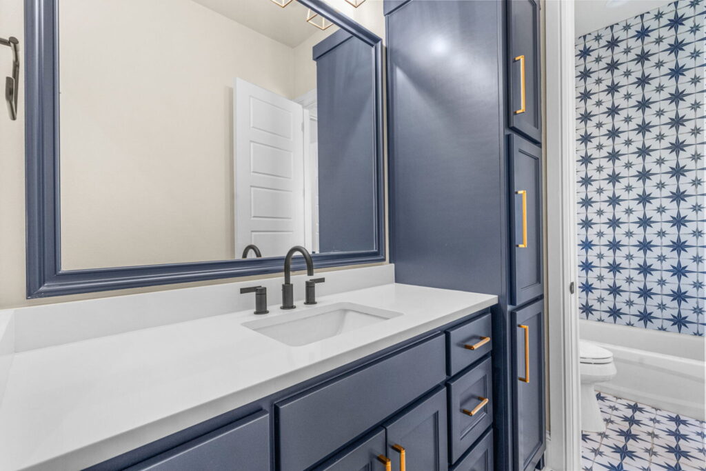 blue vanity patterned tile tub surround install remodel mckinney.jpg | The Design House