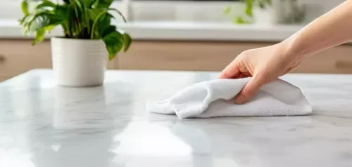Hand wiping a quantize kitchen countertop