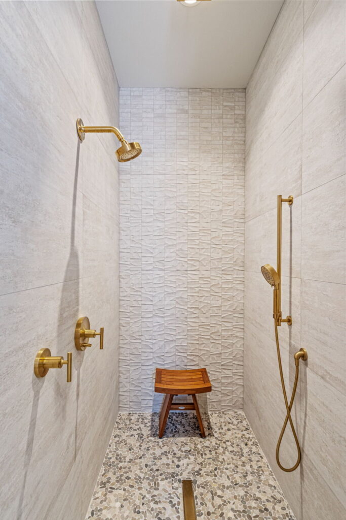 luxury walkin shower tile pebble floor denton remodel.jpg | The Design House
